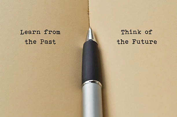 Past and Future Open book with text on both sides and a pen in the middle the past stock pictures, royalty-free photos & images