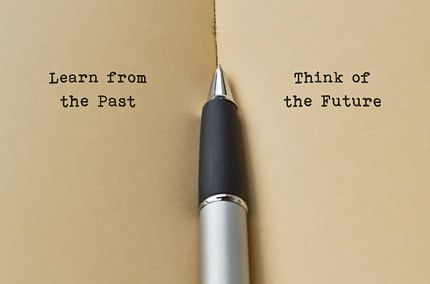 Past and Future Open book with text on both sides and a pen in the middle life lessons stock pictures, royalty-free photos & images