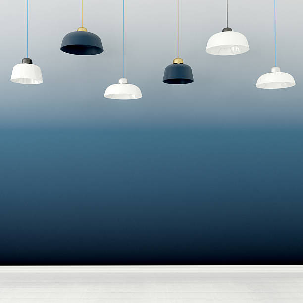 istock White and blue chandeliers  against a dark-blue wall 587541000