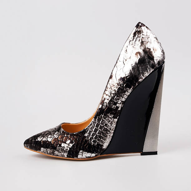 female silver shoes over white