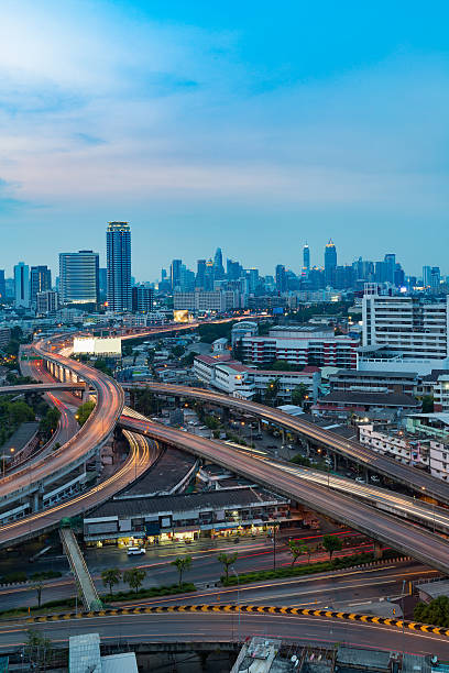 istock Highway interchanged and city downtown background 587541874