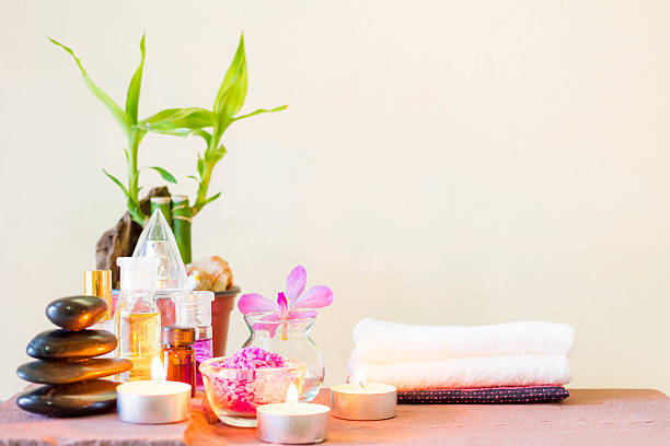 istock Spa composition with candle, pebbles and aroma oil. 587543098
