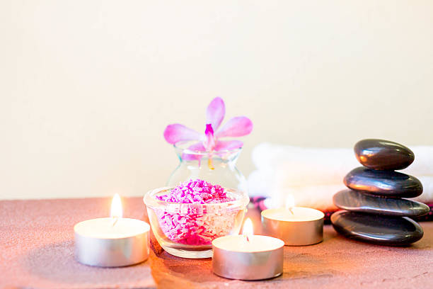 istock Spa composition with candle, pebbles and aroma oil. 587543148