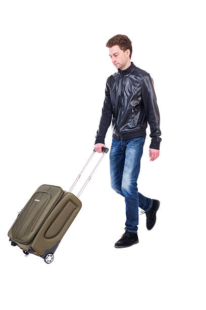 istock front  view of walking  man  with suitcase. 587543214
