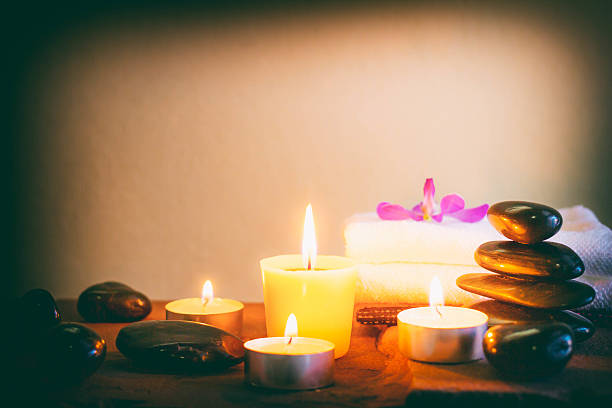 istock Spa still life with aromatic candles,orchid flower and towel. 587543280