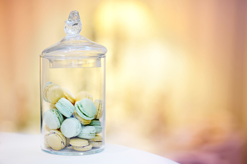 Traditional french macarons in a glass jar
