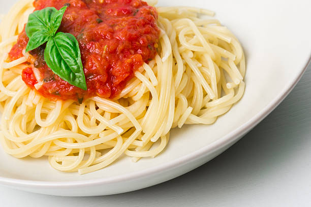 istock Original Italian Spaghetti with fresh tomato sauce and basil 587545016