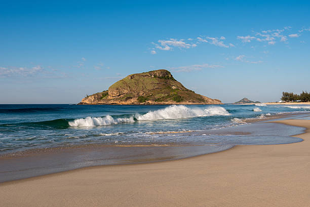 Recreio Beach in Rio de Janeiro Recreio dos Bandeirantes Beach and Pontal Rock in the Ocean in Rio de Janeiro, Brazil. headland stock pictures, royalty-free photos & images