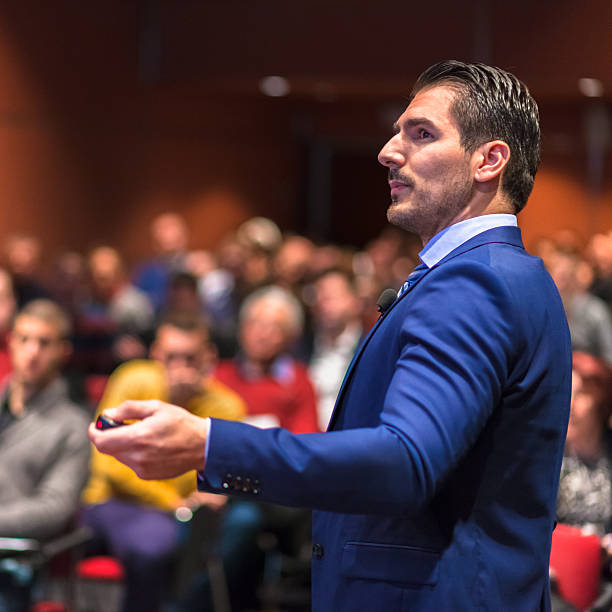 istock Public speaker giving talk at Business Event. 587550806