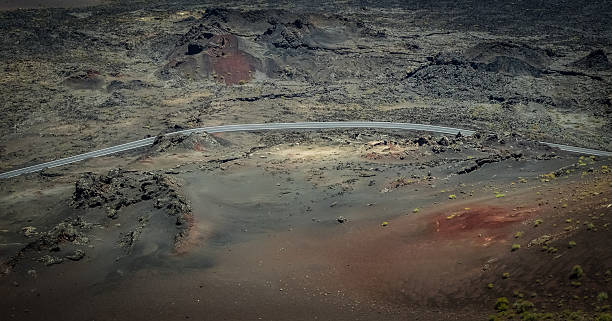istock Road through the Timanfaya National Park 587550876