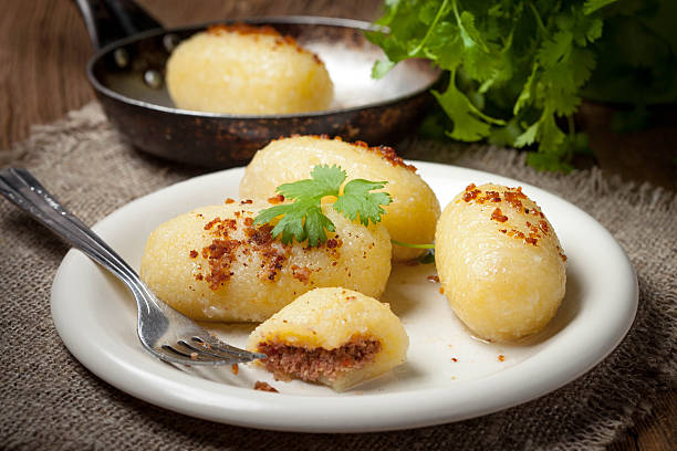 istock Potato dumplings stuffed with minced meat. 587551608