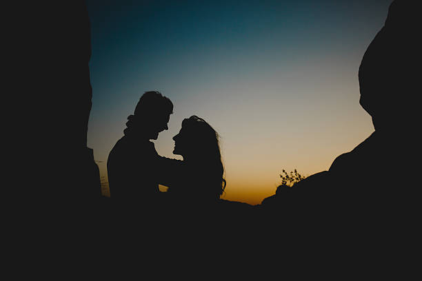 istock Embracing couple in twilight 587552374