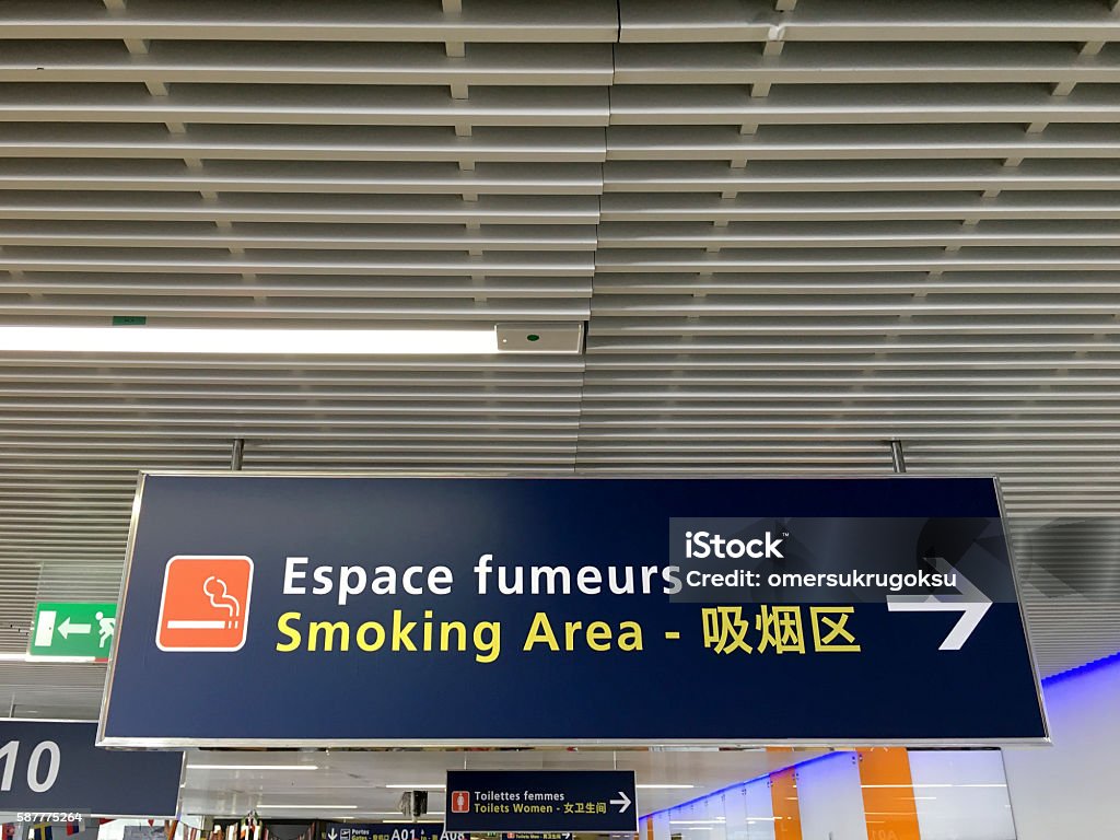 Smoking area sign Smoking area warning in Orly Airport - Paris, France. Airport Stock Photo