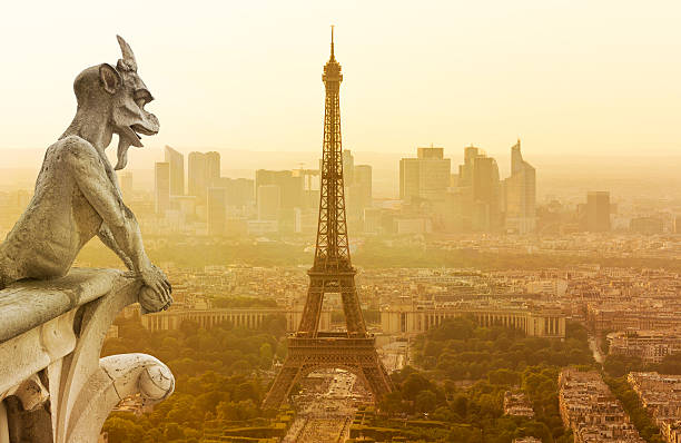 Gargoyle figur on Notre Dame looking towards Eiffel Tower