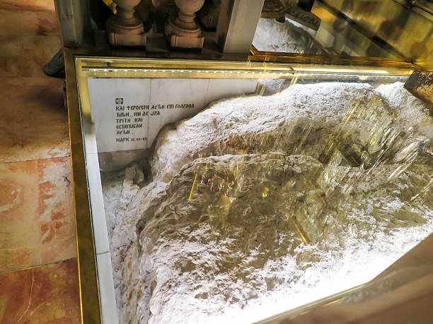 Stone Golgotha, in the Basilica of the Holy Sepulchre, Jerusalem Jerusalem, Israel - Juli 15, 2015: Stone Golgotha, the place of Jesus' death in the Basilica of the Holy Sepulchre, the holiest place of Christians, July 15, 2015 in Jerusalem, Israel tomb of the virgin mary in jerusalem stock pictures, royalty-free photos & images