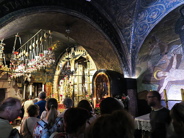 Stone Golgotha, in the Basilica of the Holy Sepulchre, Jerusalem Jerusalem, Israel - Juli 15, 2015: Stone Golgotha, the place of Jesus' death in the Basilica of the Holy Sepulchre, the holiest place of Christians, July 15, 2015 in Jerusalem, Israel tomb of the virgin mary in jerusalem stock pictures, royalty-free photos & images