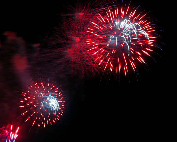 istock red colorful fireworks in the dark night 587778442
