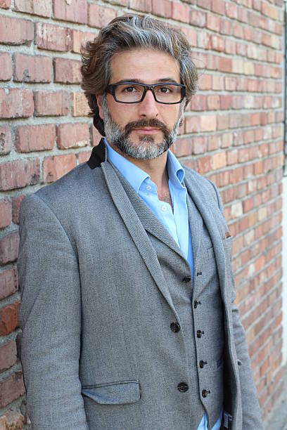istock Businessman in classic suit wearing glasses 587778494