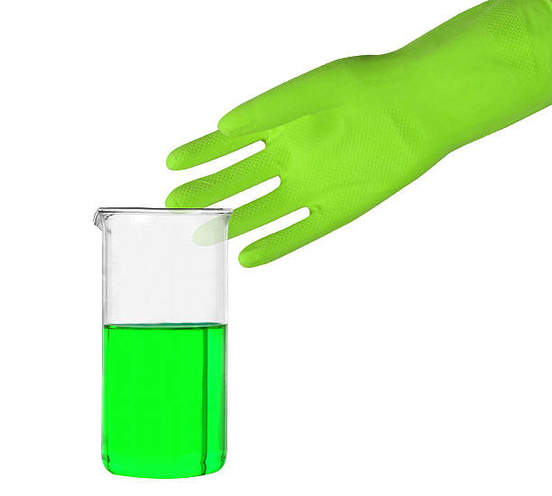 istock Green glove and a test tube 587780104