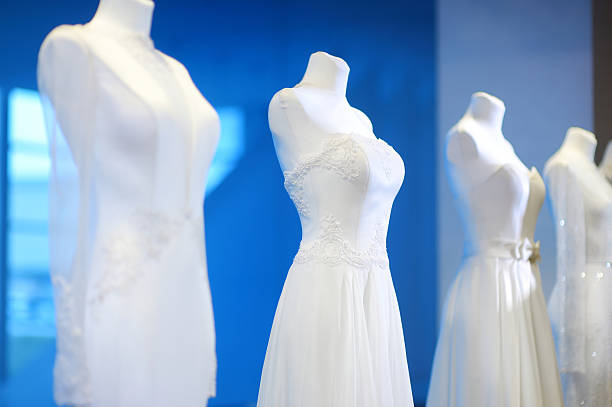 Wedding dresses on a mannequins Beautiful wedding dresses on a mannequins red evening gown mannequin indoors stock pictures, royalty-free photos & images