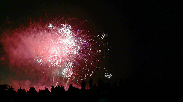 istock show with big colorful fireworks in the dark night 587781898