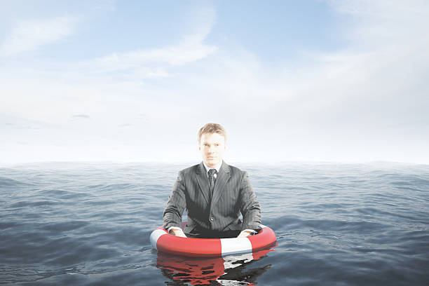 istock Businessman with lifebuoy 587782702