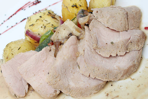 istock Roast pork with potatoes, vegetables and sauce 587782904
