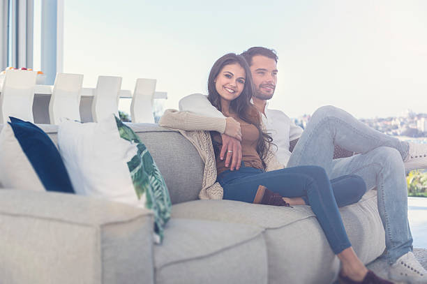 istock Couple relaxing on the sofa. 587782906
