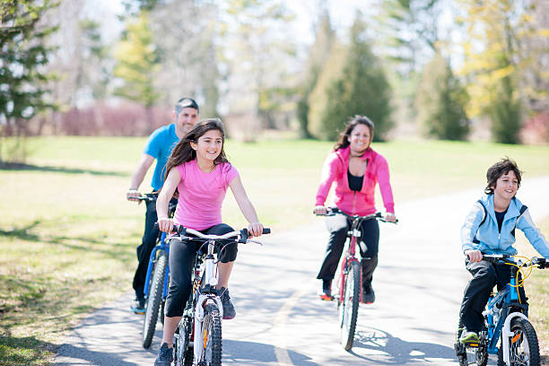 istock Riding Bikes Together on a Sunny Day 587784862