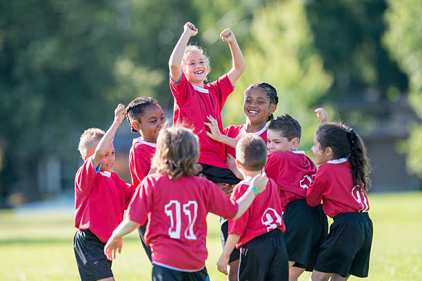 istock Holding a Teammate Up in the Air 587785230
