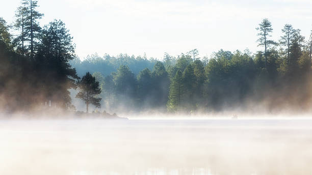 istock Misty Morning Lake at Sunrise 587786244