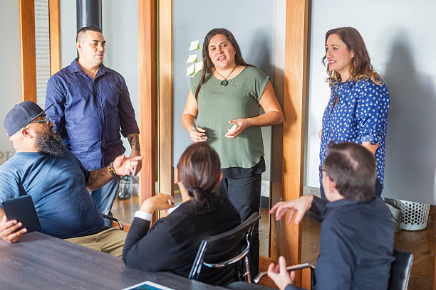 Successful Maori Pacific Islander Business Woman Leading a Team Meeting stock photo