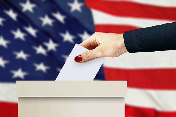 istock women hand casting a vote 587789666