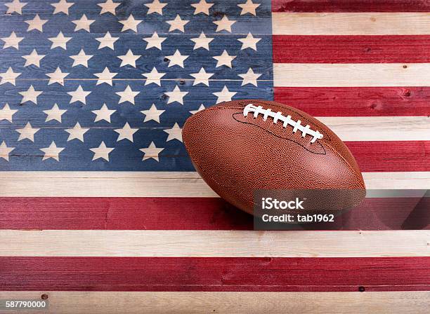 American Football On Rustic Wooden Usa Flag Stock Photo - Download Image Now - Flag, USA, American Football - Ball