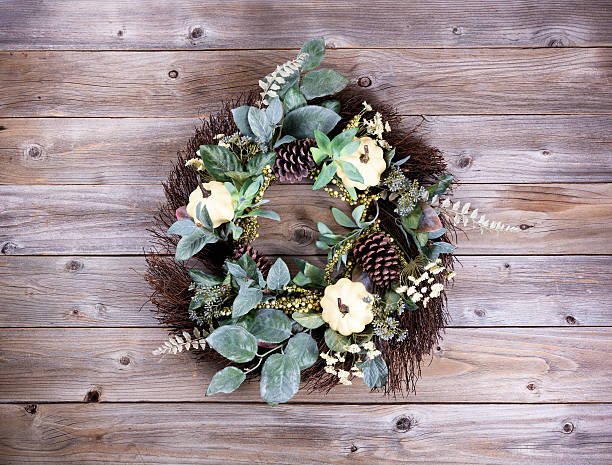 istock Autumn holiday wreath on rustic wooden boards 587790070