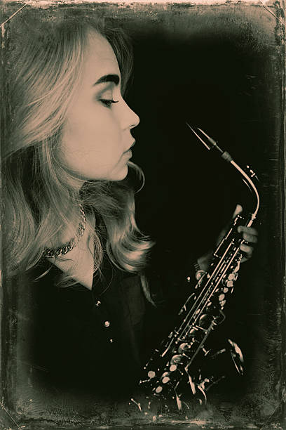 istock Teen holding saxophone 587790128