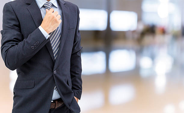 istock isolated business man on shopping mall background 587790474