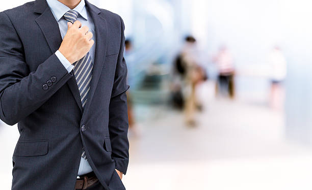 istock isolated business man on shopping mall background 587790566