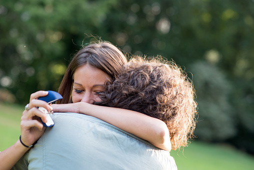 Couple in the park: Wedding proposal engagement