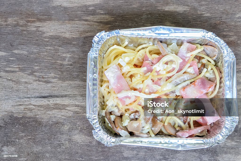 Spaghetti Carbonara in Floyd box on wood background George Floyd Protests Stock Photo