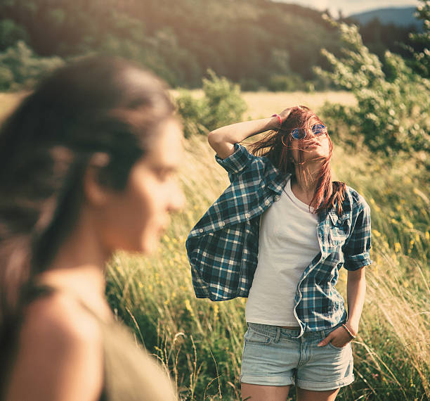 Portrait of two women standing in the fields