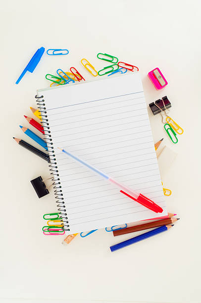 istock Notebook with pen on top of school stationery 587794158