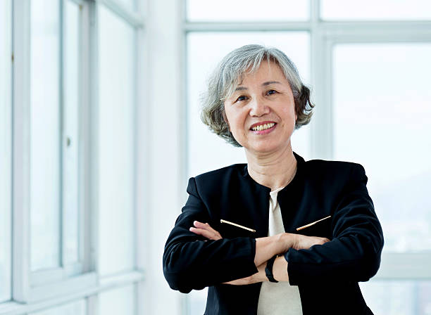 istock Senior businesswoman in modern office 587795390