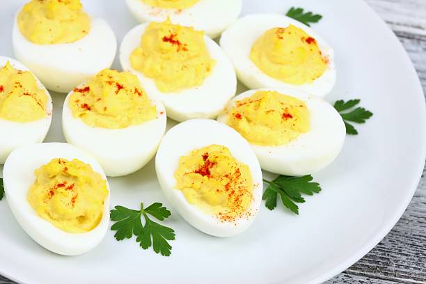 istock Deviled eggs filled with blend of yolks,  mayonnaise and  mustard 587796228