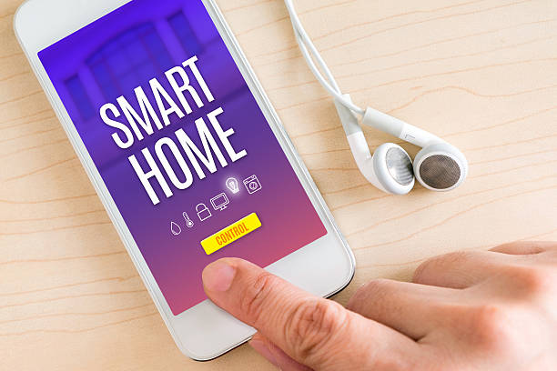 istock Hand touch smart phone and ear phone with smart home 587797362