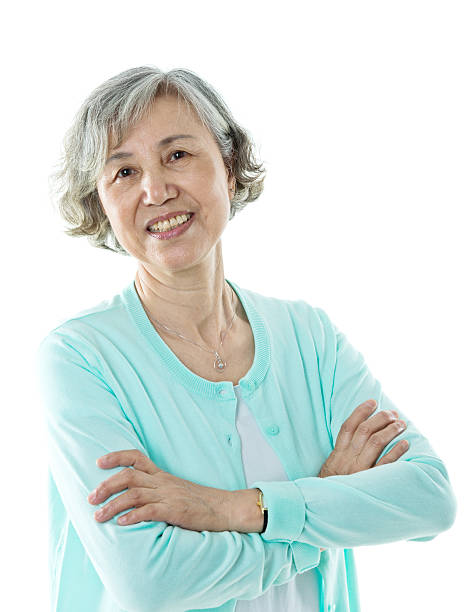 istock Beautiful senior woman smiling against white background 587797706