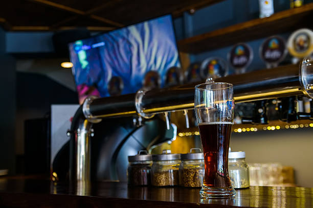 istock Glass of beer at pub 587798824