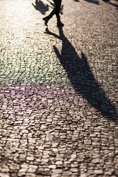 istock Urban life concept, people shadows on streets 587800232