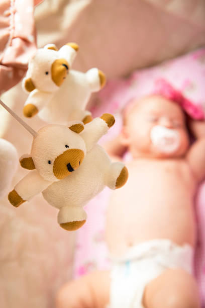 istock Beautiful baby sleeping sweetly in the cradle 587800246