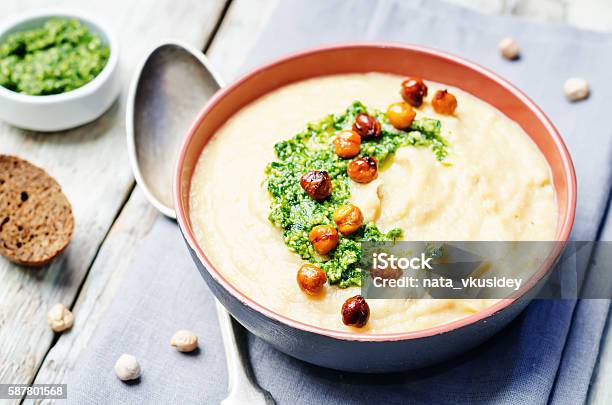 Cauliflower Chickpea Soup With Cilantro Pesto And Roasted Chickpeas Stock Photo - Download Image Now